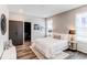 Serene bedroom with a plush bed, stylish decor, and ample natural light at 20936 E 61St Ave, Aurora, CO 80019