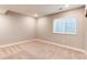 Cozy bedroom showcasing a neutral palette, soft carpet, a window, and recessed lighting at 20936 E 61St Ave, Aurora, CO 80019