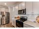 Well-appointed kitchen featuring stainless steel appliances and ample countertop space at 20936 E 61St Ave, Aurora, CO 80019