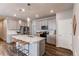 Spacious kitchen with modern appliances, an island with bar seating, and pendant lighting at 20936 E 61St Ave, Aurora, CO 80019