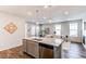 Open-concept kitchen featuring stainless appliances and large center island at 20936 E 61St Ave, Aurora, CO 80019
