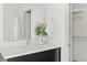Modern bathroom with a floating vanity and walk-in closet at 1682 Tabor St, Lakewood, CO 80215