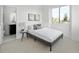 Bright bedroom with a queen-size bed and en-suite bathroom at 1682 Tabor St, Lakewood, CO 80215