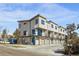 Modern townhome development showcasing multiple units with attached garages and a clean, contemporary aesthetic at 1682 Tabor St, Lakewood, CO 80215