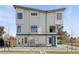 Modern home boasting clean architectural lines, stone accents, and contemporary windows at 1682 Tabor St, Lakewood, CO 80215