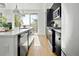 Modern kitchen with stainless steel appliances and white countertops at 1682 Tabor St, Lakewood, CO 80215