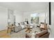 Spacious living area with gray sectional sofa and large windows at 1682 Tabor St, Lakewood, CO 80215