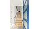 Bright entryway showcases a modern staircase with sleek railing and a vibrant blue door at 1682 Tabor St, Lakewood, CO 80215