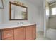 Well-lit bathroom features a vanity with ample counter space and a combined tub and shower area at 15805 W 14Th Pl, Golden, CO 80401