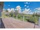 Spacious wooden deck with white railings overlooks a beautiful green landscape at 15805 W 14Th Pl, Golden, CO 80401