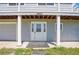 Welcoming front entrance features decorative glass door, white columns, and visible house number at 15805 W 14Th Pl, Golden, CO 80401