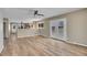 Bright living room with hardwood floors, double doors, and an open concept to kitchen at 15805 W 14Th Pl, Golden, CO 80401