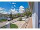 A side view from the wooden deck shows neighborhood street and beautiful mountain views beyond at 15805 W 14Th Pl, Golden, CO 80401