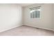 Empty bedroom with neutral carpet and one window at 1849 Village View Ln, Castle Rock, CO 80104