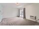 Carpeted bedroom featuring a sliding glass door that leads to the outside at 2504 S Victor St # E, Aurora, CO 80014