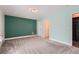Bedroom with a dark green accent wall and views of the closet at 2504 S Victor St # E, Aurora, CO 80014