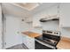 Updated kitchen featuring butcher block countertops, and stainless steel appliances at 2504 S Victor St # E, Aurora, CO 80014