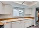 Classic kitchen featuring an undermount sink and butcher block countertops, with lots of light at 2504 S Victor St # E, Aurora, CO 80014