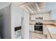 A kitchen with stainless steel oven and a modern refrigerator at 2504 S Victor St # E, Aurora, CO 80014