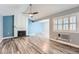Inviting living room featuring a classic fireplace, ceiling fan, and lots of natural light at 2504 S Victor St # E, Aurora, CO 80014