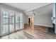 Living room with doors leading outside and wood floors at 2504 S Victor St # E, Aurora, CO 80014