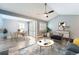 Open-concept living room and dining area with plenty of natural light at 2504 S Victor St # E, Aurora, CO 80014