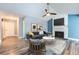 Cozy living room with fireplace, ceiling fan and stylish decor at 2504 S Victor St # E, Aurora, CO 80014