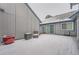 Exterior patio featuring wood siding with blue trim and some snow on the ground and furniture at 2504 S Victor St # E, Aurora, CO 80014
