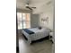 Bedroom features a ceiling fan and a large window with natural light at 5755 N Genoa Way # 14-105, Aurora, CO 80019