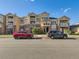 Attractive townhouses featuring a combination of tan siding and brick, accented by a private balcony at 5755 N Genoa Way # 14-105, Aurora, CO 80019