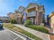 Attractive townhouse exteriors with brick accents, charming balconies, and well-maintained landscaping at 5755 N Genoa Way # 14-105, Aurora, CO 80019