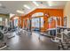 Large community gym with free weights, elliptical machines, and a mirrored wall at 5755 N Genoa Way # 14-105, Aurora, CO 80019