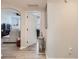Inviting hallway with views to the living room and study, showcasing open layout at 5755 N Genoa Way # 14-105, Aurora, CO 80019