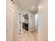 Bright hallway with wood floors and arched doorways leading to different rooms at 5755 N Genoa Way # 14-105, Aurora, CO 80019