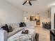 Comfortable living room area leading to the kitchen and dining, perfect for seamless living at 5755 N Genoa Way # 14-105, Aurora, CO 80019