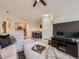 Bright living area blending into kitchen and dining room, creating an open and inviting atmosphere at 5755 N Genoa Way # 14-105, Aurora, CO 80019