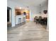 Open-concept living space leading to kitchen and dining area with modern furnishings at 5755 N Genoa Way # 14-105, Aurora, CO 80019