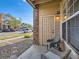 Welcoming porch with two chairs providing a view of the building's exterior at 5755 N Genoa Way # 14-105, Aurora, CO 80019
