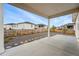 A covered patio and stone landscaping create a relaxing outdoor space at 4063 Castle Vista Dr, Castle Rock, CO 80104