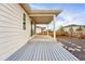 Covered patio with deck and access to the house through sliding glass doors at 4063 Castle Vista Dr, Castle Rock, CO 80104
