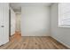 A spacious bedroom with hardwood floors, a window, and white trim at 4063 Castle Vista Dr, Castle Rock, CO 80104