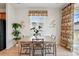 Bright dining room with a wooden table and chairs, decorative window treatments, and view of the backyard at 4063 Castle Vista Dr, Castle Rock, CO 80104