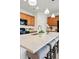 Modern kitchen featuring a large center island with barstool seating, stylish pendant lights, and stainless faucet at 4063 Castle Vista Dr, Castle Rock, CO 80104