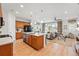 Open kitchen featuring a large island, modern appliances, and seamless flow into the living area at 4063 Castle Vista Dr, Castle Rock, CO 80104