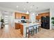 Open concept kitchen boasts a large center island, stainless steel appliances and ample cabinet space at 4063 Castle Vista Dr, Castle Rock, CO 80104