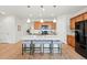Open kitchen features a large island with seating and is perfect for entertaining guests at 4063 Castle Vista Dr, Castle Rock, CO 80104