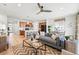 Bright, open-concept space featuring a kitchen with island seating that flows into the living and dining areas at 4063 Castle Vista Dr, Castle Rock, CO 80104