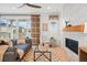 Comfortable living room with sliding glass doors, fireplace, and stylish decor at 4063 Castle Vista Dr, Castle Rock, CO 80104