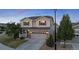 Two-story house with a two-car garage and landscaped front yard at 9574 Cherry Ln, Thornton, CO 80229