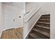 Elegant staircase leading to the upper level of the home at 9574 Cherry Ln, Thornton, CO 80229